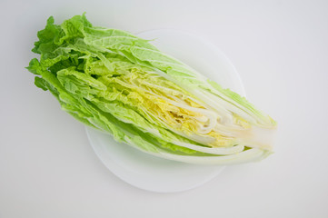 Chinese cabbage (in Japan called Hokusai) cut in poplam on a white isolated background close-up