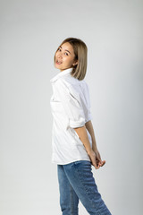 Portrait of Young Asian pretty cute cheerful woman wearing braces and looking at camera on white background. natural make-up, and white teeth