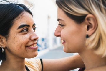 Loving lesbian couple at the street.