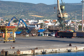 Volos  , Greece , 5/8/2020 . Mobile port cranes are loading scrap metal for recycling