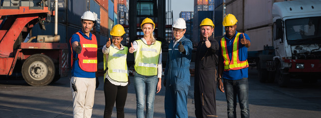 Fototapeta premium Group of foreman man & woman worker working checking at Container cargo harbor to loading containers. Dock male and female staff business Logistics import export shipping concept.