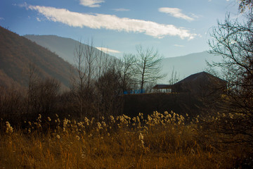 House in the mountains at sunset day.