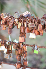 Tha Mai, Chanthaburi, Thailand, 7 September 2019, Padlocks show symbol of a couples everlasting love, forever and togetherness, Hang the keys on the suspension cable to show confidence in love