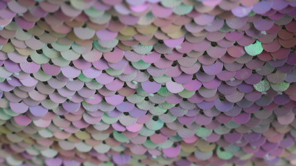 multi-colored sequins with a predominance of pink as a designer texture background