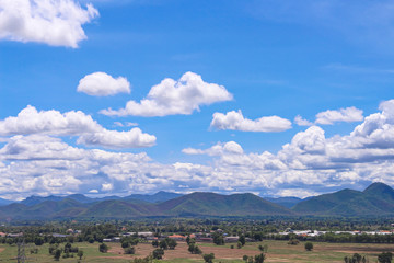 Fototapeta na wymiar Landscape bright blue sky with clouds , mountains over Lamphun city in Thailand