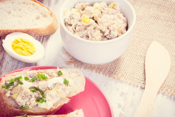 Vintage photo, Mackerel or tuna fish paste sandwiches with egg and chives