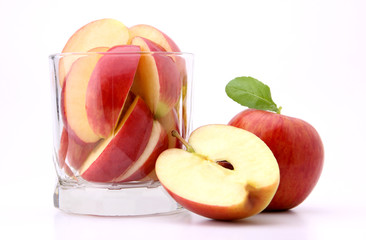apples in glass cup isolated on the white background in studio photo.