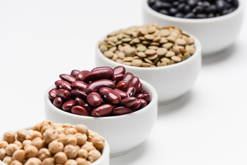 Red kidney beans and blurred legumes. 4 varieties of pulses (dry edible seeds of plants), the focus...