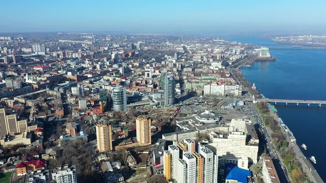 Aerial urban sunny city view from drone. Top view of Dnopropetrovsk city with view of river Dnipro and different buildings blocks from the high
