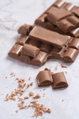 Delicious and tasty milk chocolate bar on a white background