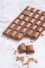 Delicious and tasty milk chocolate bar on a white background