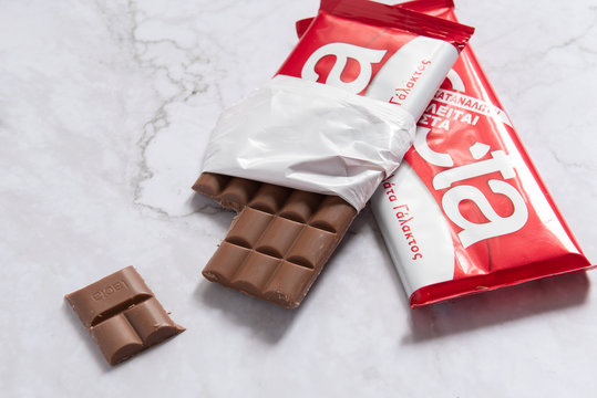 Delicious and tasty milk chocolate bar on a white background