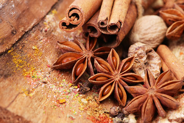 Fragrant spices on a wooden background