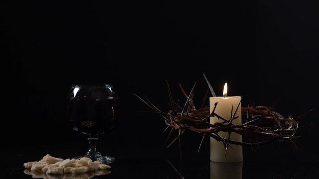 Crown Of Jesus, Candle Bread and Wine on Black Background