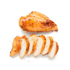 Grilled chicken breast. Sliced chicken fillet isolated on white background.