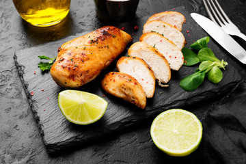 Grilled chicken breast. Sliced chicken fillet with lime.