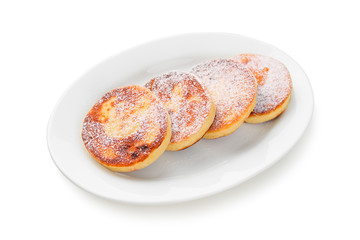 Cottage cheese pancakes isolated on white background