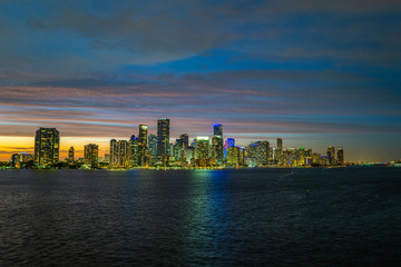 Fototapeta na wymiar Miami Florida, HDR. Miami city skyline panorama at dusk with urban skyscrapers and bridge over sea with reflection.