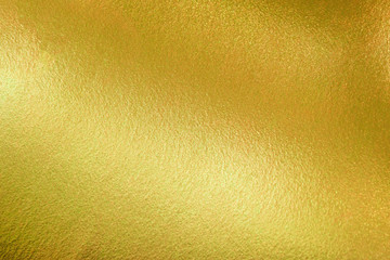 Gold texture background with yellow luxury shiny shine glitter sparkle of bright light reflection on golden surface