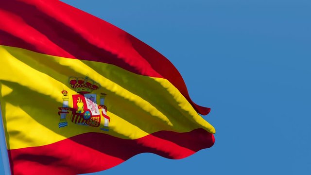 The national flag of Spain is flying in the wind