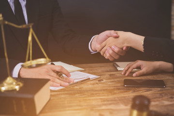 The hard work of an asian lawyer in a lawyer's office. Counseling and giving advice and prosecutions about the invasion of space between private and government officials to find a fair settlement.