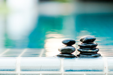 Spa still life with water lily and zen stone.