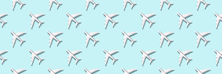 Creative banner of white planes on blue background. Travel, vacation concept. Travel, vacation ban. Flights cancelled and resumed again. Top view. Flat lay. Minimal style design. Summer pattern.
