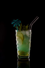 Mojito cocktail over black background. Cocktail Mojito in the nightclub