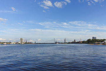 View across the river Daugava to the cable-stayed bridge and the city on the opposite bank, Riga, Latvia