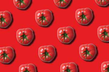 Organic tomato pattern on trendy red background with copy space. Top view. Flat lay. Creative packing design. Summer minimal concept. Vegan and vegetarian diet