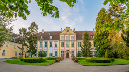 Abbots Palace in the rococo style and located in Oliwa Park in spring scenery. - obrazy, fototapety, plakaty