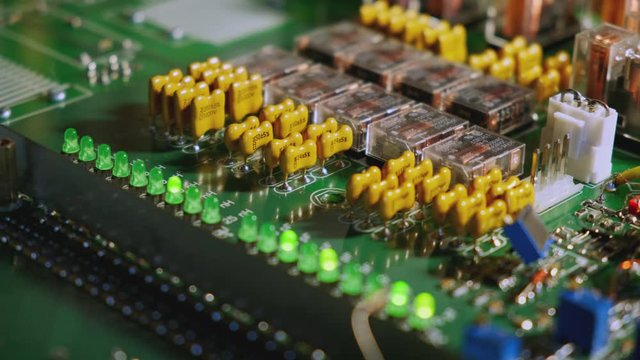 Switching relays and LEDs on the matching board. Closeup.
