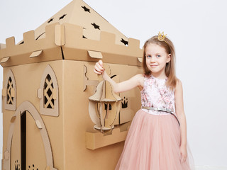 The princess play with cardboard castle tower.