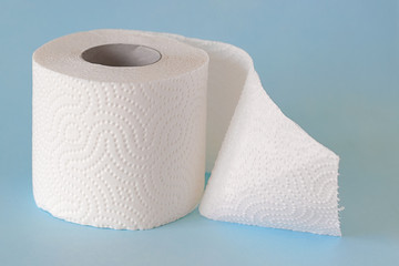 one roll of white clean toilet paper on a blue background