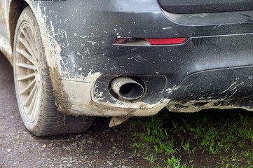 Fototapeta na wymiar Exhaust pipe of a dirty vehicle