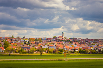 The town of Dettingen in Baden-Württemberg, Germany. Small german village. Cloudy sky, bright...