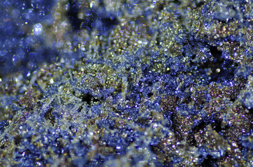Macro of blue and golden shimmering mineral stone. Pyrite stone.