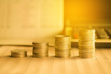 stacks of gold money coin background concept saving money with vintage filter