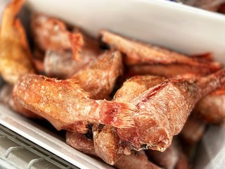 Frozen red fish on a store sail. Mobile photo.