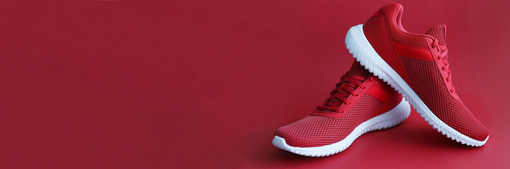 Colorful sport shoes on mustard color backround