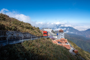 landscape view at Fansipan peak mountain, there are temple and buddha statue on the top famous place for travel in Sapa city, Vietnam.