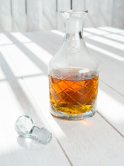 Whisky decanter standing on a wood table