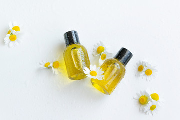 Essential oil with chamomile flower extract. Hygiene bath product. Wellness therapy regeneration