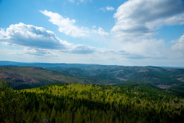Mountain landscape.Magnificent panoramic view of the forest and beautiful blue sky. The beauty of wild virgin nature. peace