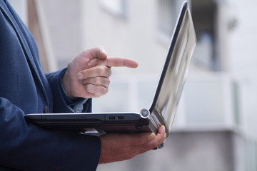 businessman with his laptop close up view