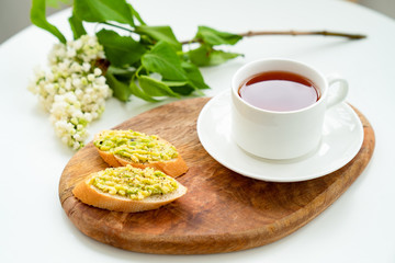 healthy breakfast. tea and sandwich with avocado.