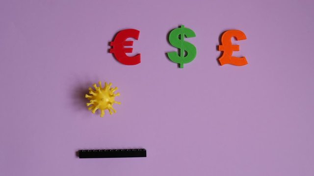 Arkanoid Bing Ball virus COVID 19 symbol destroys currency symbols. Coronavirus attacks colorful money signs. Blue background. Stop motion animation.