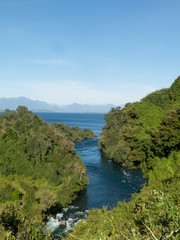 Fototapeta na wymiar Birth of the Rio Bueno, leaving Lake Ranco. In the region of Los Ríos, in Araucanía or Patagonia, Chilean Andes. South of Chile.