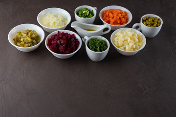 Ingredients for vinaigrette, national salad of beets, pickles, peas, potatoes, carrots, olive oil.