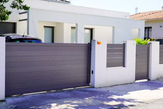 street suburb home grey brown dark metal aluminum house gate slats garden access door